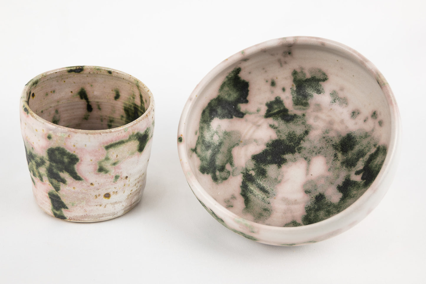 White glaze bowl with splashed oxide with added texture