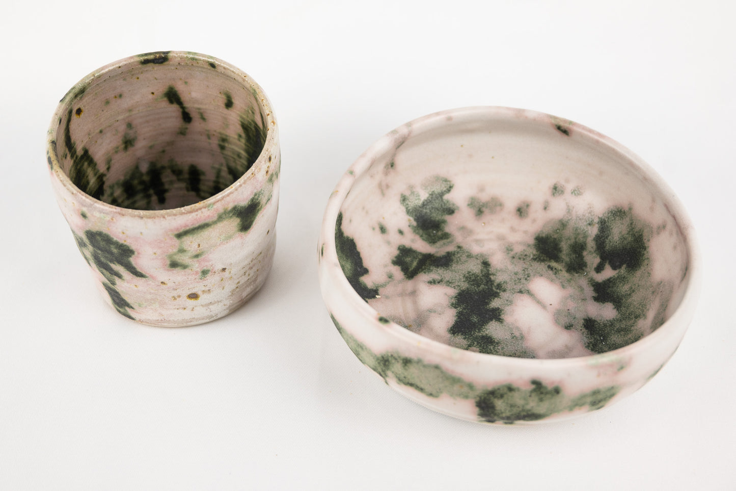 White glaze bowl with splashed oxide with added texture