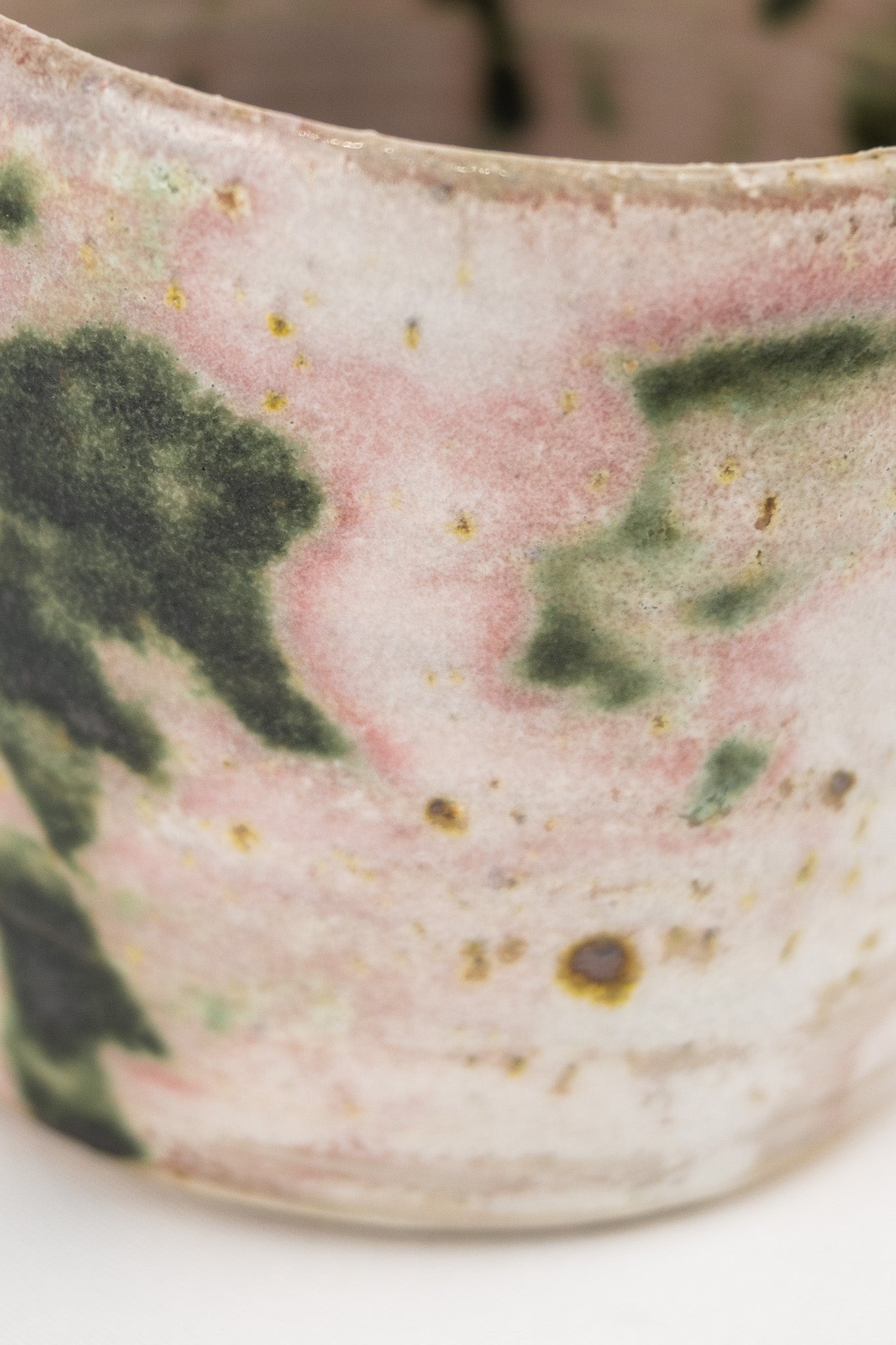 White glaze bowl with splashed oxide with added texture