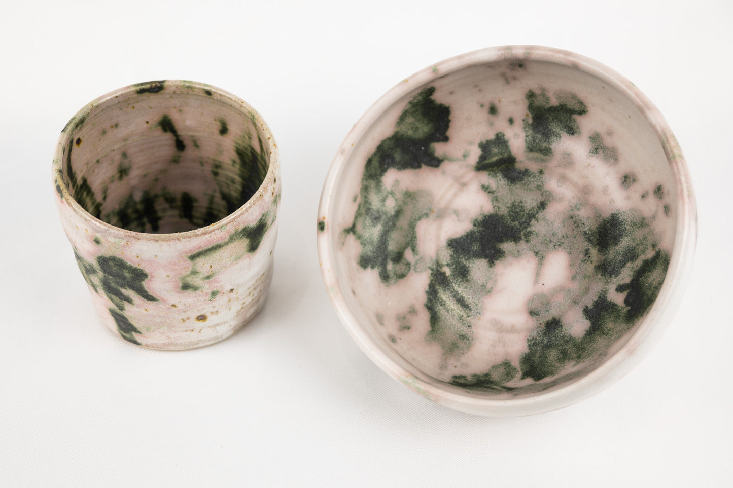 White glaze bowl with splashed oxide with added texture