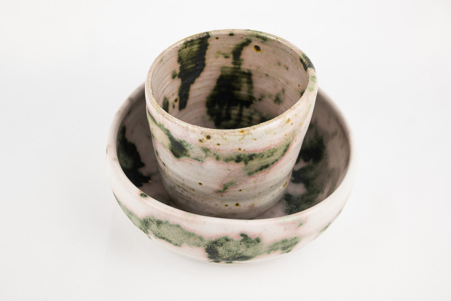 White glaze bowl with splashed oxide with added texture