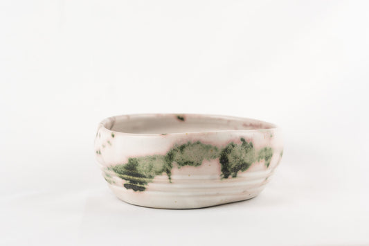 White glaze bowl with splashed oxide with added texture