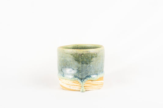 Pistachio drip glaze mug with two marbled clay bodies pinched for comfort
